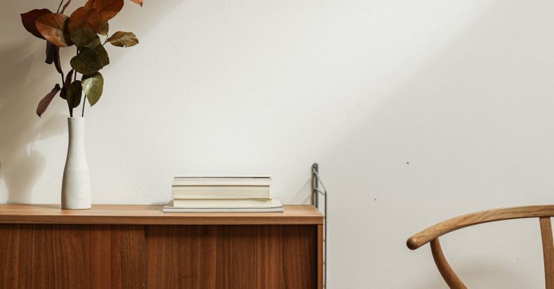 Minimalist Kitchen - Brown Wooden Chair Beside Brown Wooden Cabinet