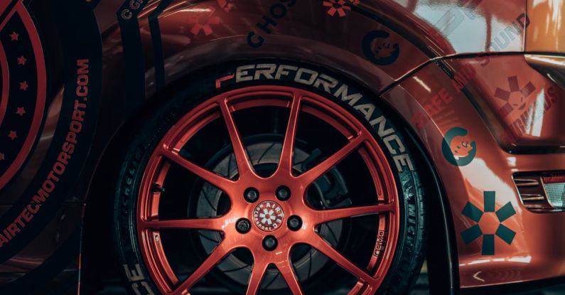 Custom Backsplash - A close up of a car with red rims