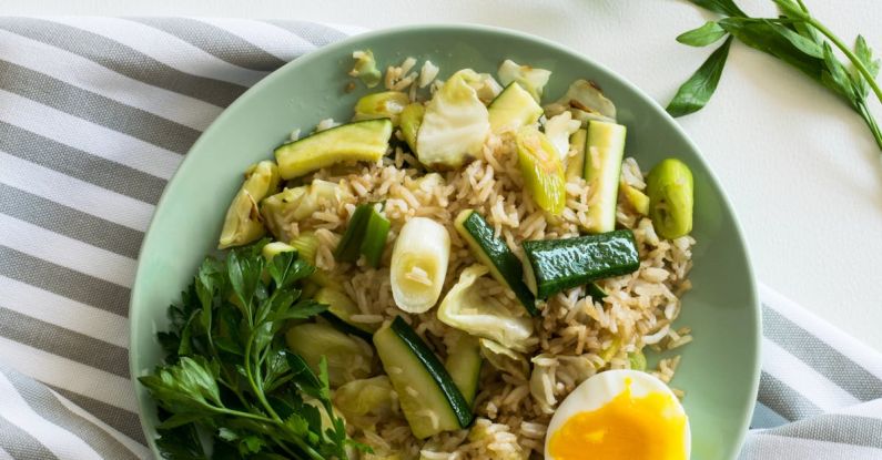 Green Kitchens - Rice With Zucchini, Soft Boiled Egg, and Parsley in Green Ceramic Plate