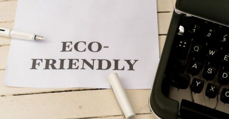 Eco-Friendly Materials - Eco-friendly paper with typewriter and pen