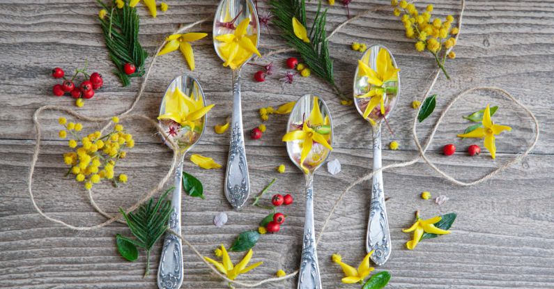 Metal Accents - Spoons with flowers and leaves on a wooden table