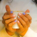 Warmth - Woman in White Long-sleeved Top Holding White Cup