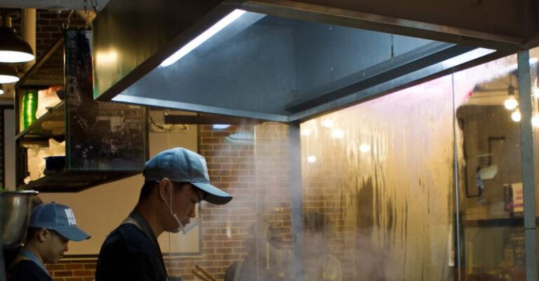 Industrial Kitchen - Man Holding Cooking Utensil