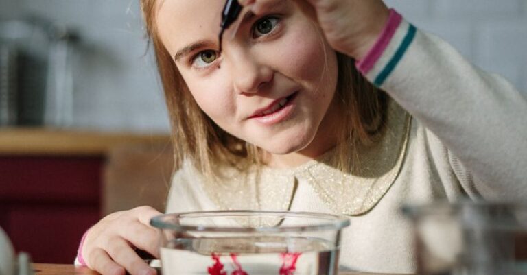 Color Combinations - Girl Mixing Colors in Bowl with Water