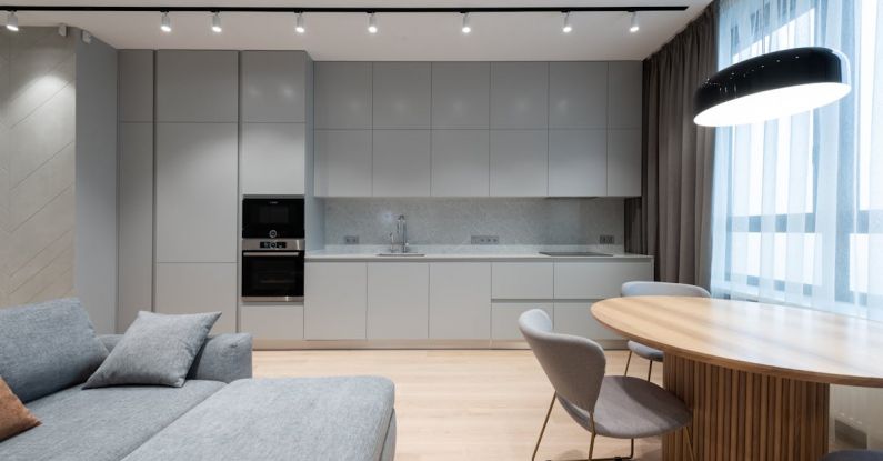 Compact Kitchen - Interior of modern residential apartment with comfortable furniture and compact kitchen in grey shades