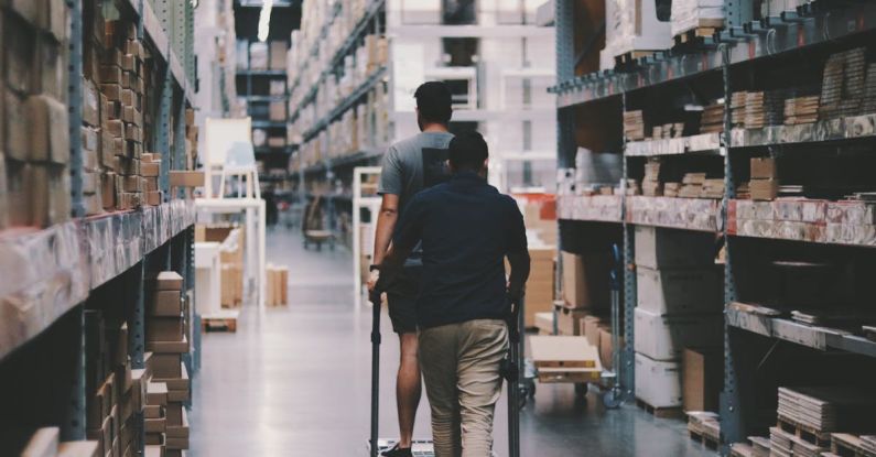 Storage - Men Going Around a Warehouse