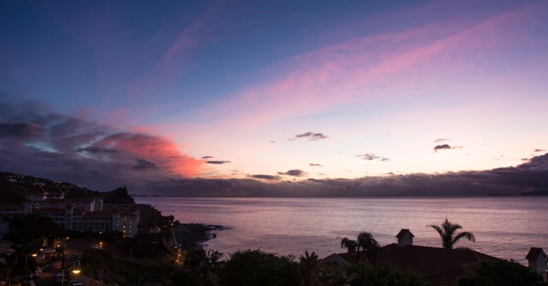 Island Lighting - Town Beside Sea during Golden Hour