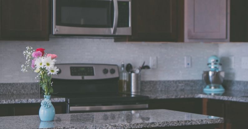 Kitchen Island - Flowers On Vase On A Kitchen Counter