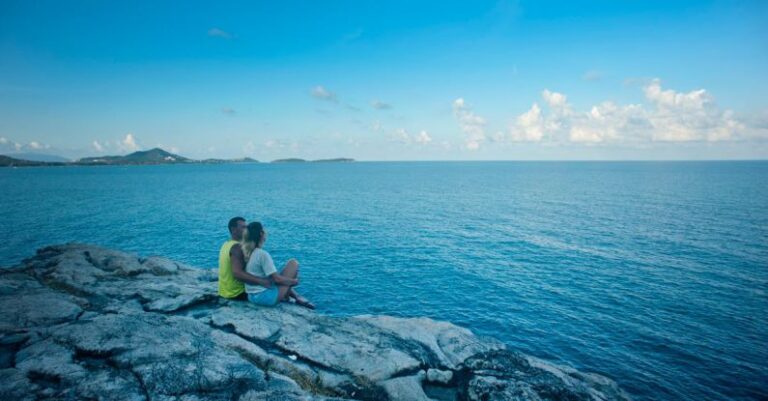 Island Seating - Man and Woman Sitting Near Body of Water