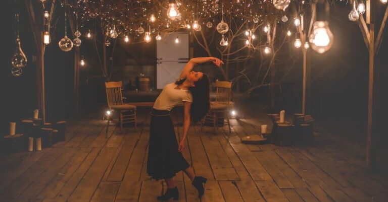 Lighting Bulbs - Woman Dancing on Terrace With Lights Turned-on