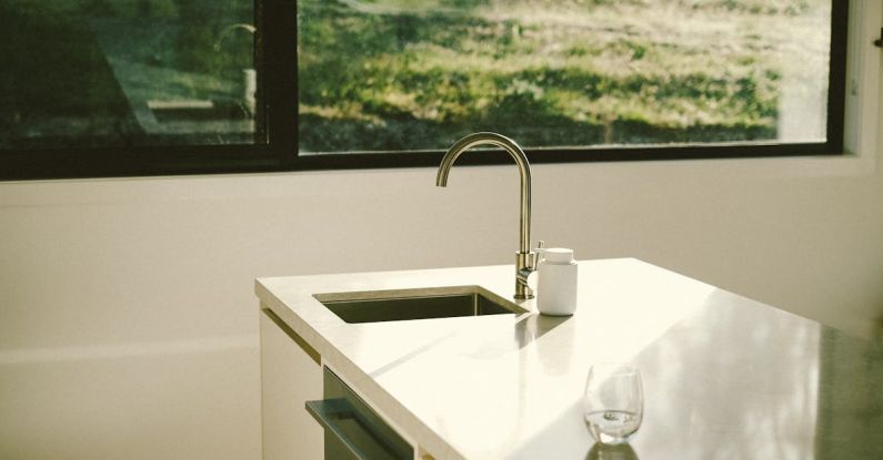 Kitchen Ambiance - A kitchen sink with a window in the background