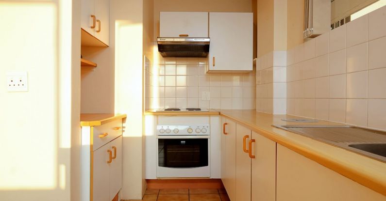 Minimalist Kitchens - A kitchen with a stove and oven in it